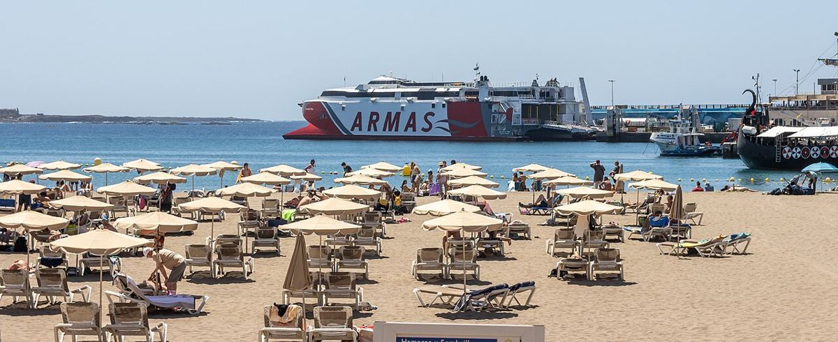 Los Cristianos — At Tenerife 2023 487 - Volcan de Teno and Ragnarok at the Port of Los Cristianos behind Playa Honda